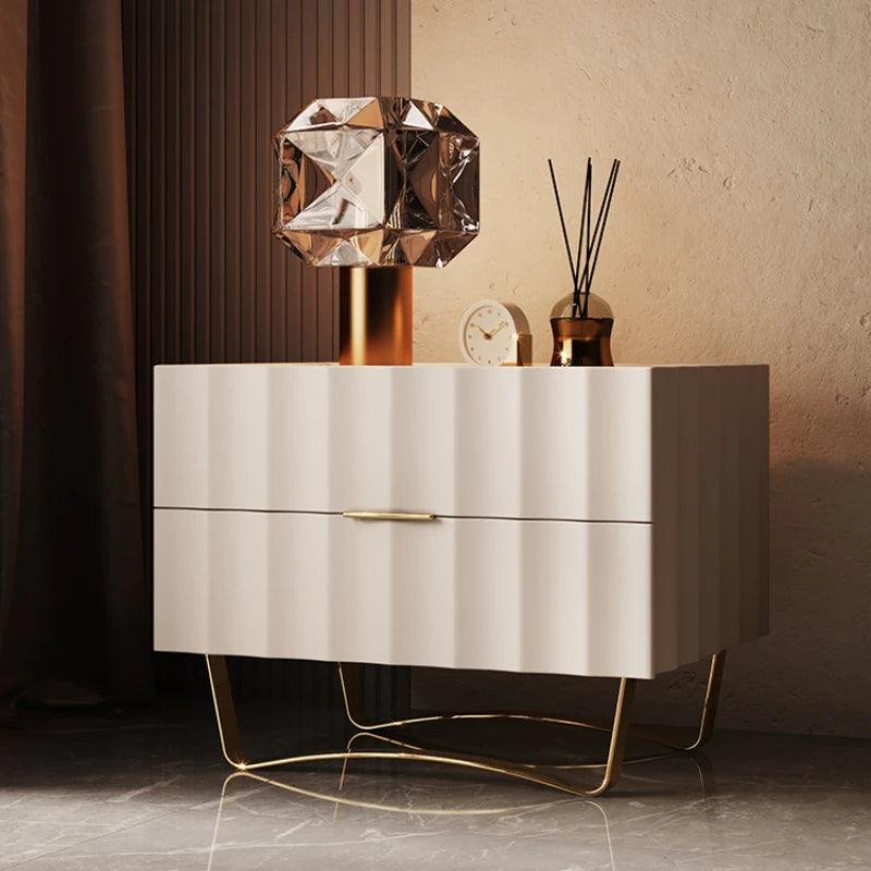 Cream two-drawer cabinet standing on slender metal legs