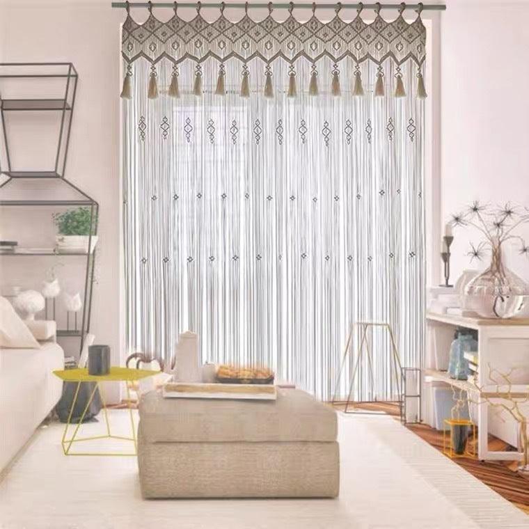 Cream woven hanging curtain with a long fringed edge