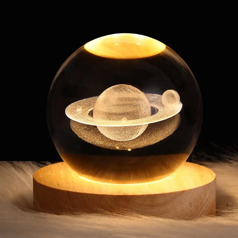Saturn crystal sphere illuminated above a wooden base